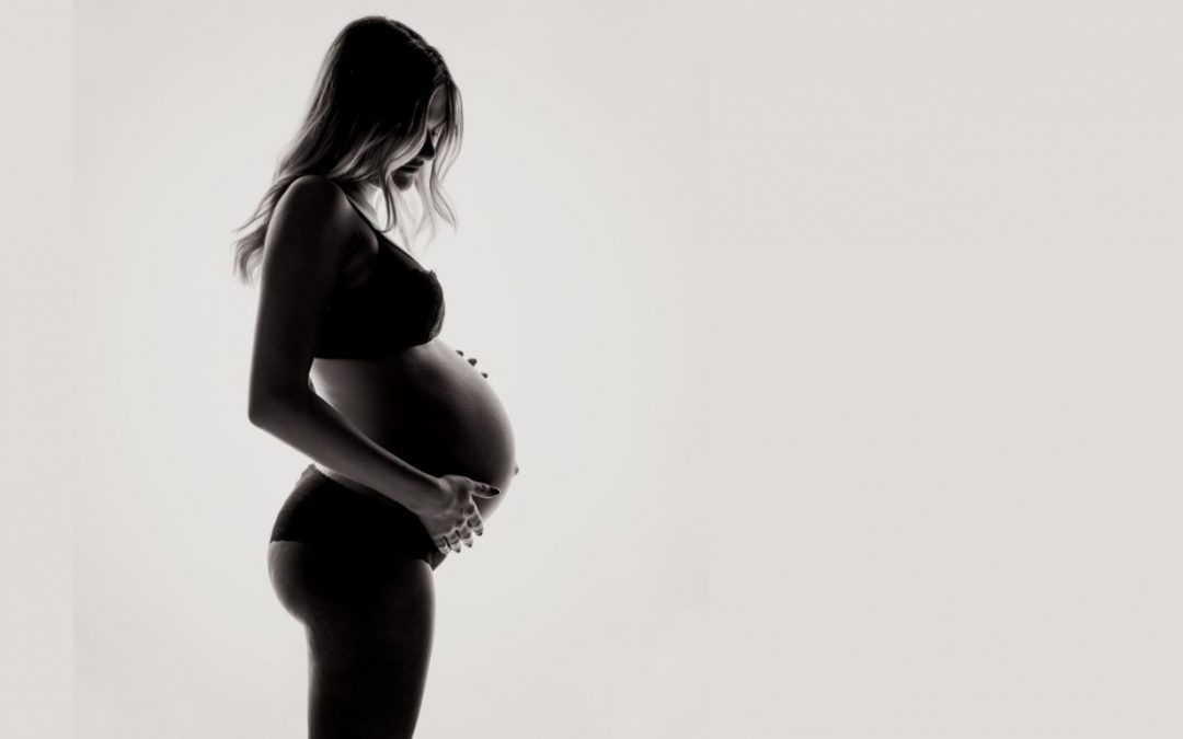 Black and White photo of a pregnant woman