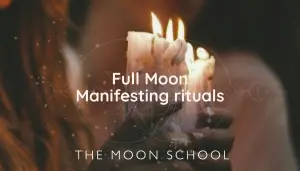 Candle held in hands for full moon manifesting ritual