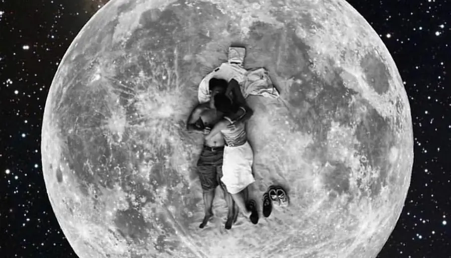 Couple cuddling on surface of Full Moon
