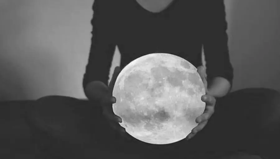 Woman holding Full Moon
