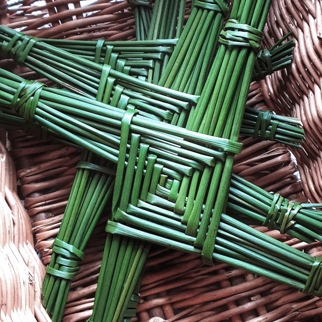 St Brigid's cross woven from grasses in a basket