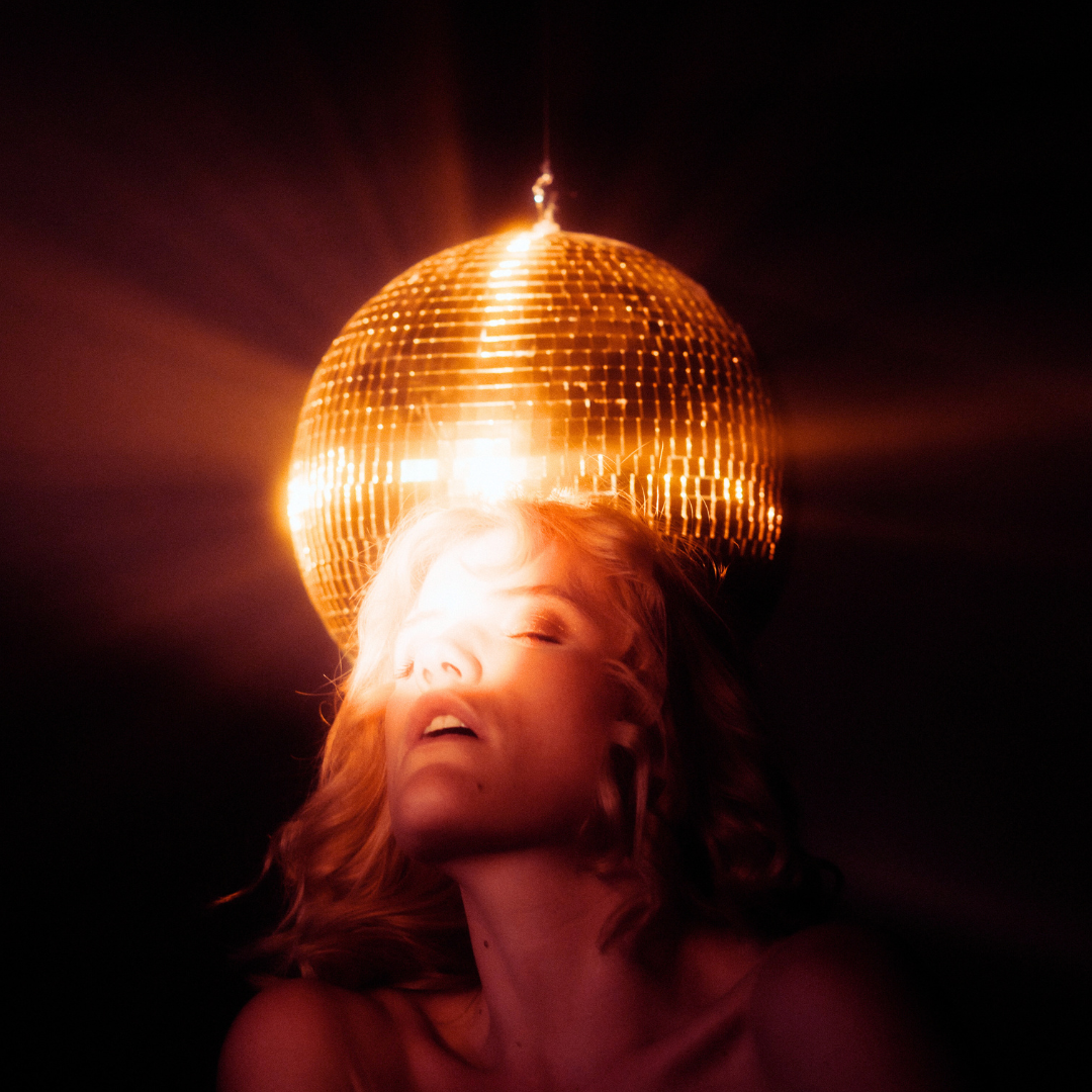 Seduction woman with golden disco light