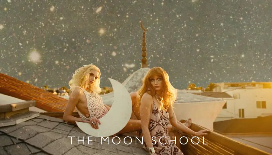 Boho spiritual women with waxing crescent Moon on rooftop