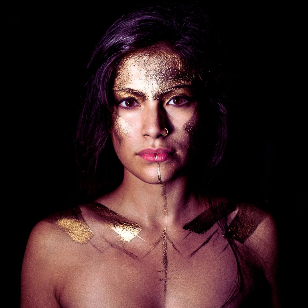 Female archetype goddess with gold paint