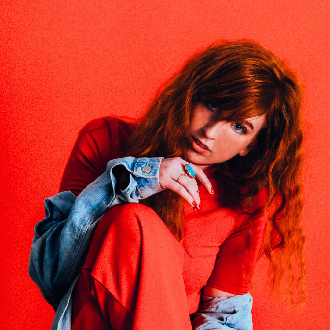 women with red hair in her red and white moon cycle