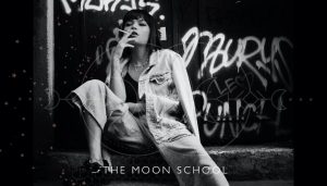 dark mother as young woman smoking with grafitti