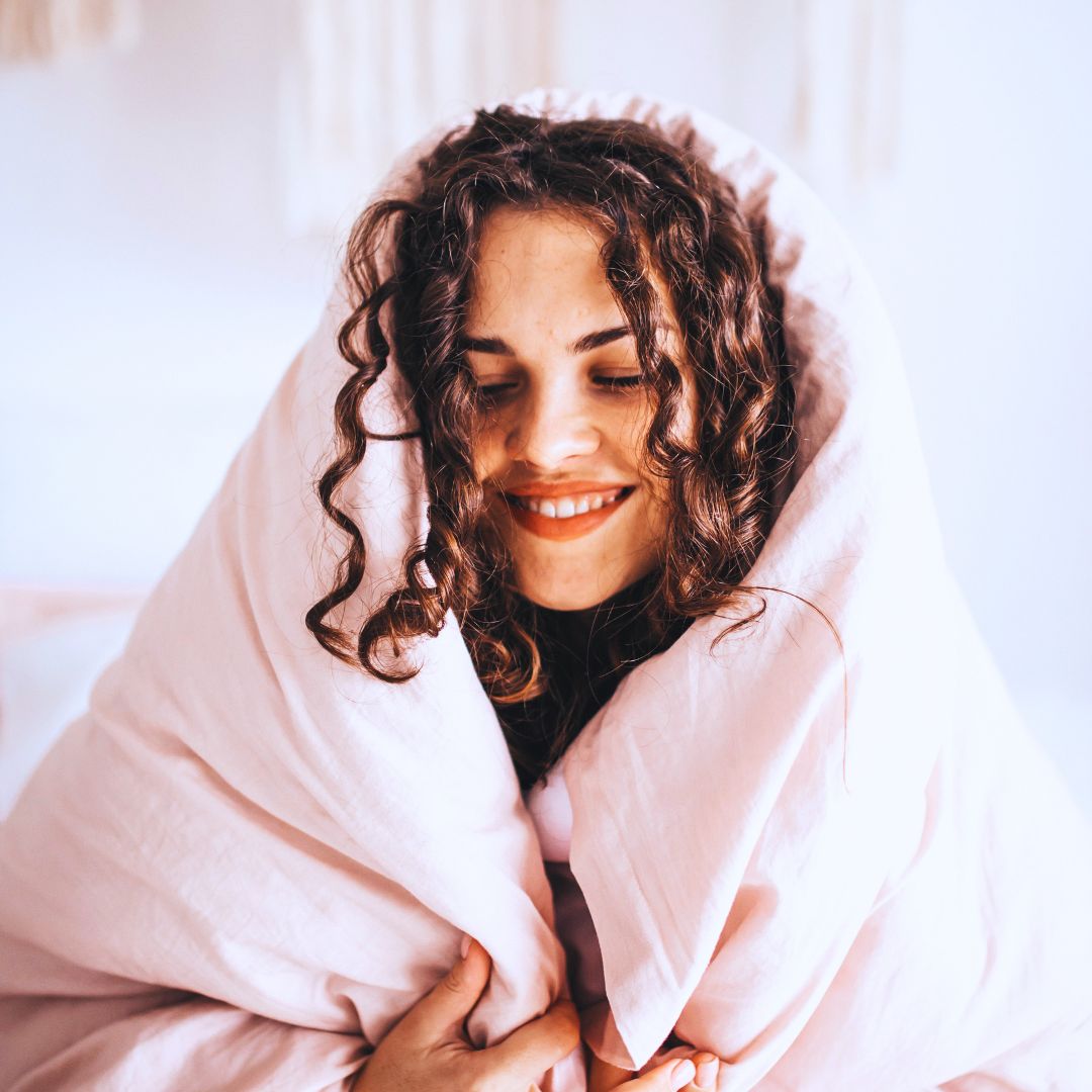 Woman wrapped up in duvet