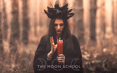 witchy woman under lunar light in a forest with red candles performing a full Moon ritual