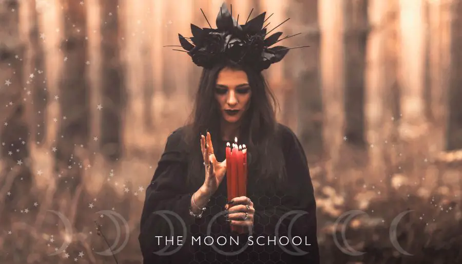 witchy woman under lunar light in a forest with red candles performing a full Moon ritual