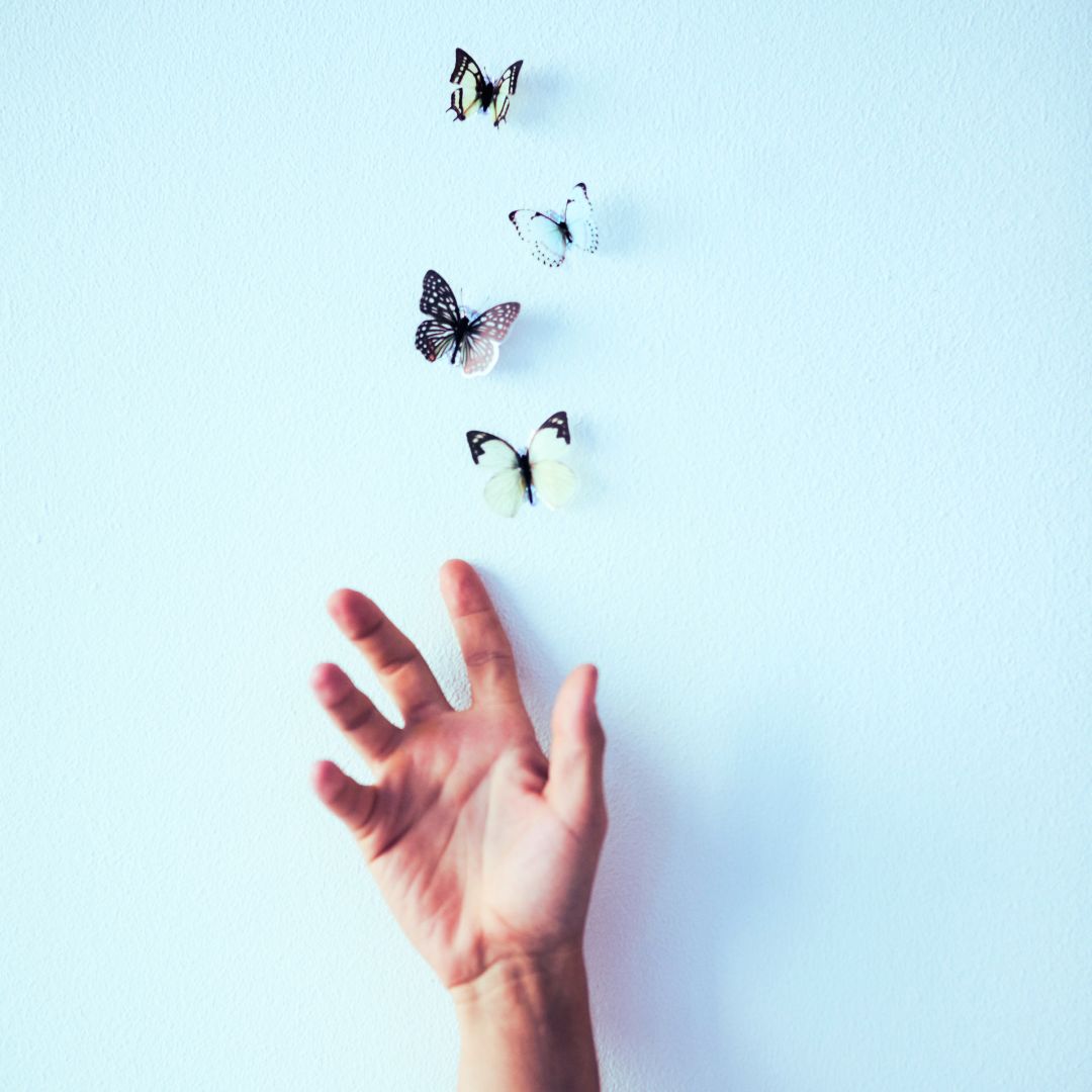 Hand releasing butterflies