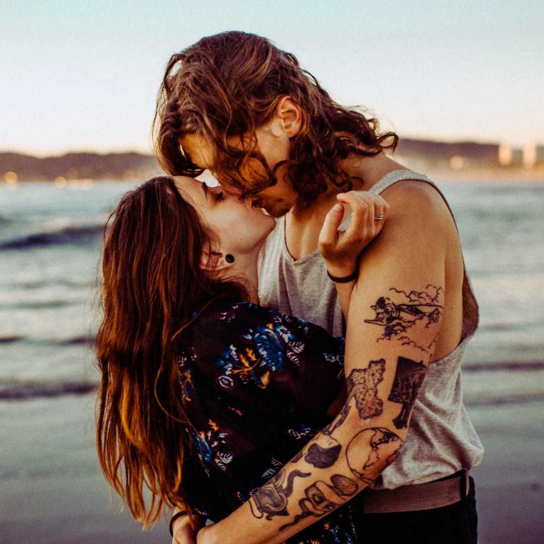 Couple kissing on new years eve on the beach