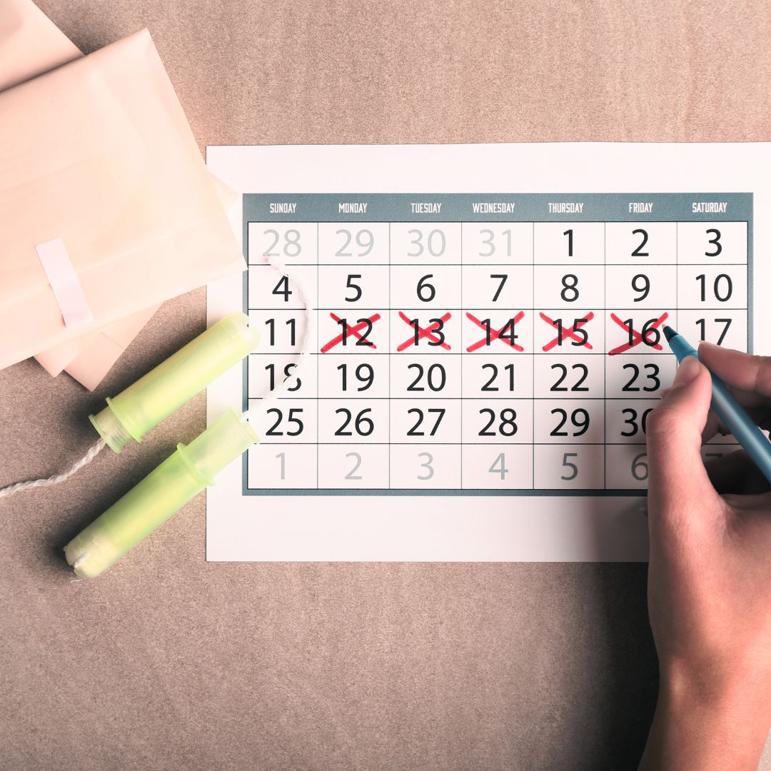 menstrual bleeding days marked on a calendar