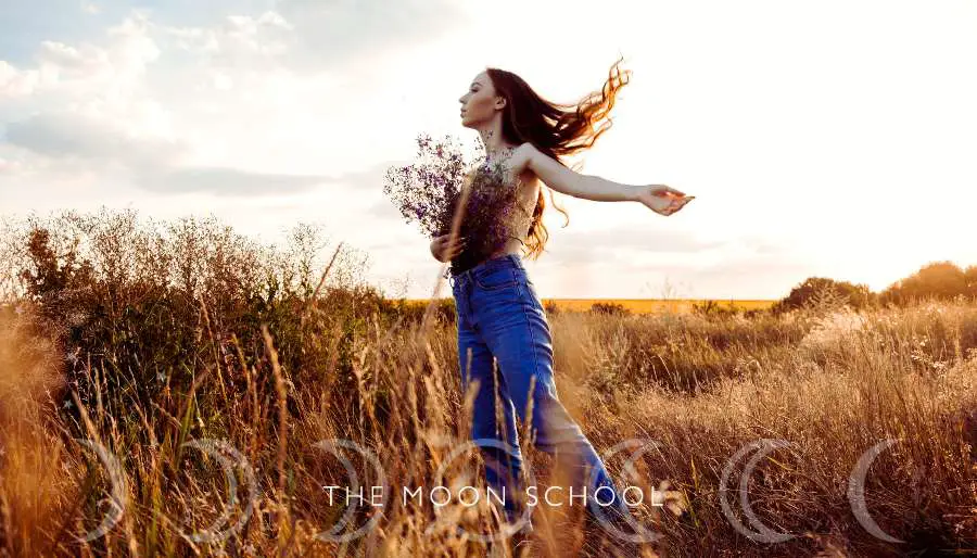 Woman outside in nature performing a new years eve ritual