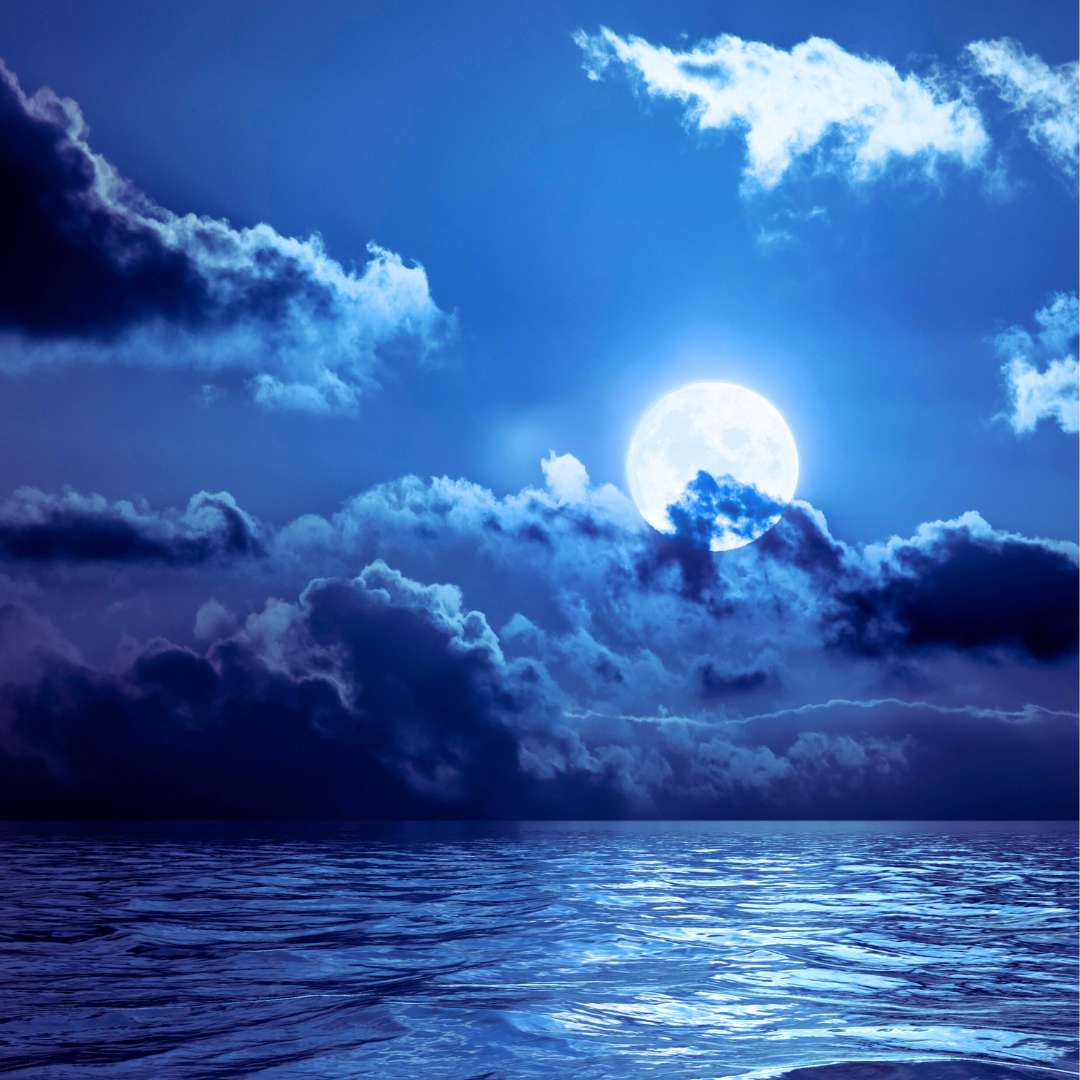 Blue Moon rising over the ocean
