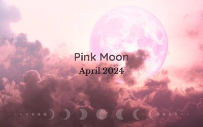 spiritual Pink Moon rising through clouds