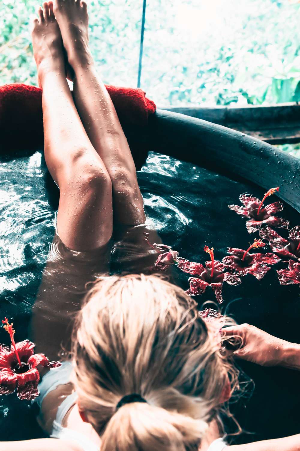 Spiritual woman with her feet up enjoying a ritual bath