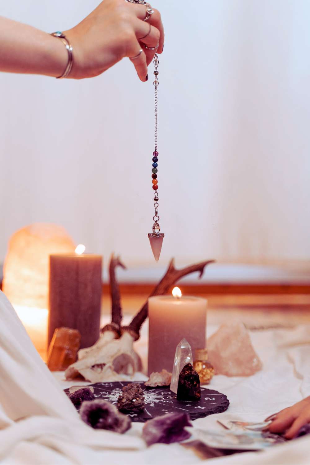 Wiccan woman using a Pendulum 