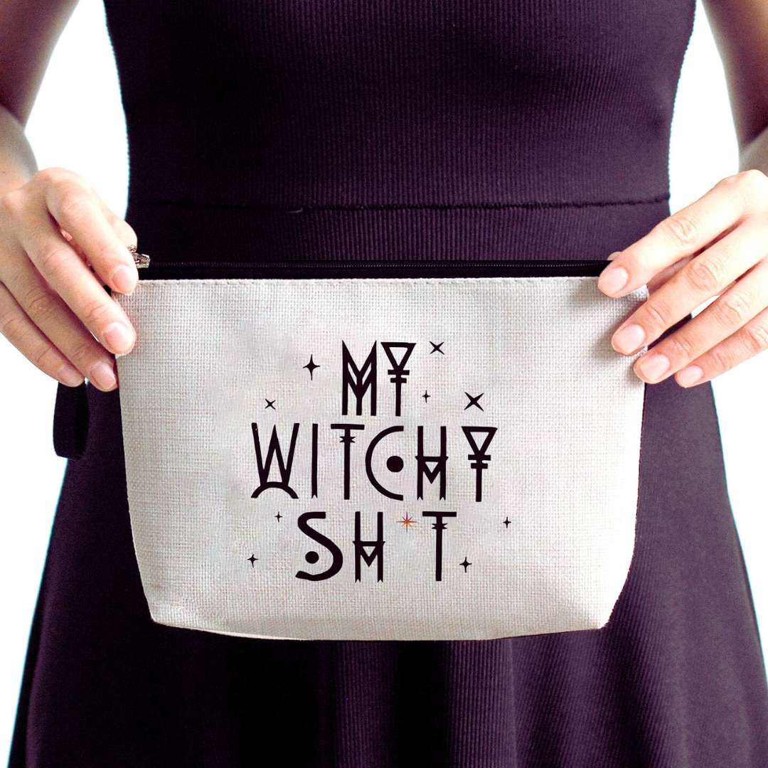 wiccan holding a make up bag that says my witchy sh*t. Ideal gift idea
