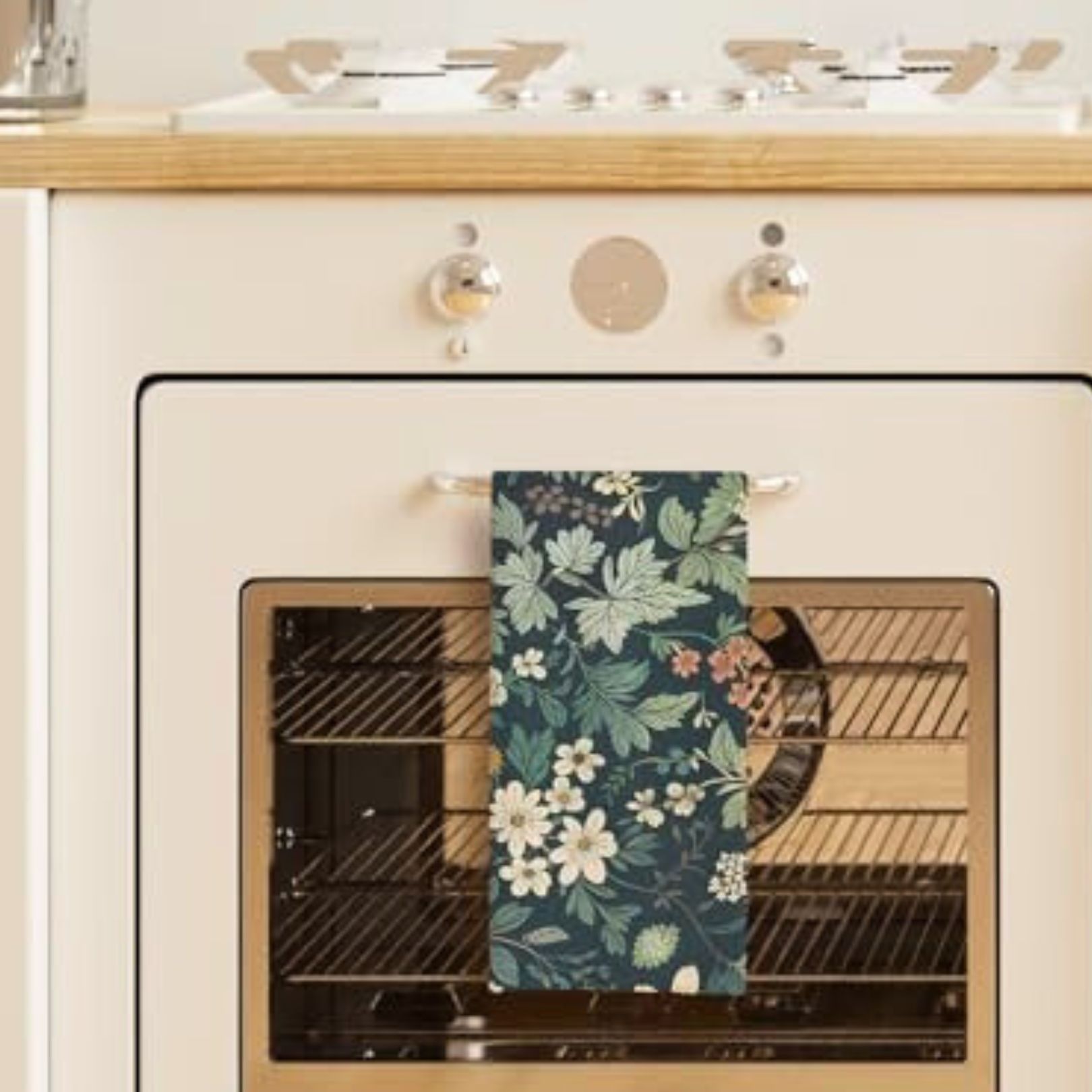 botanical green witch tea towel hanging in a boho cottage kitchen