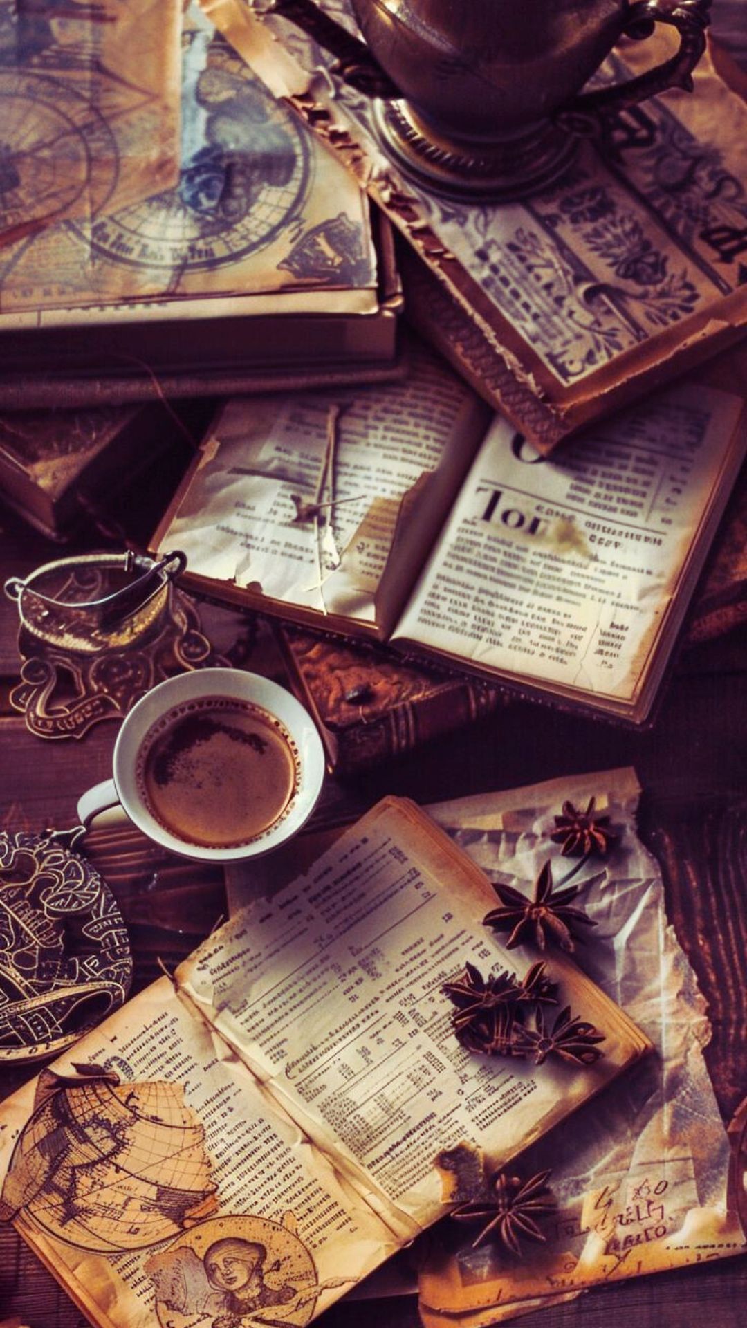 Beautiful old world aesthetic image of an open book of shadows on a wooden desk with coffee cup
