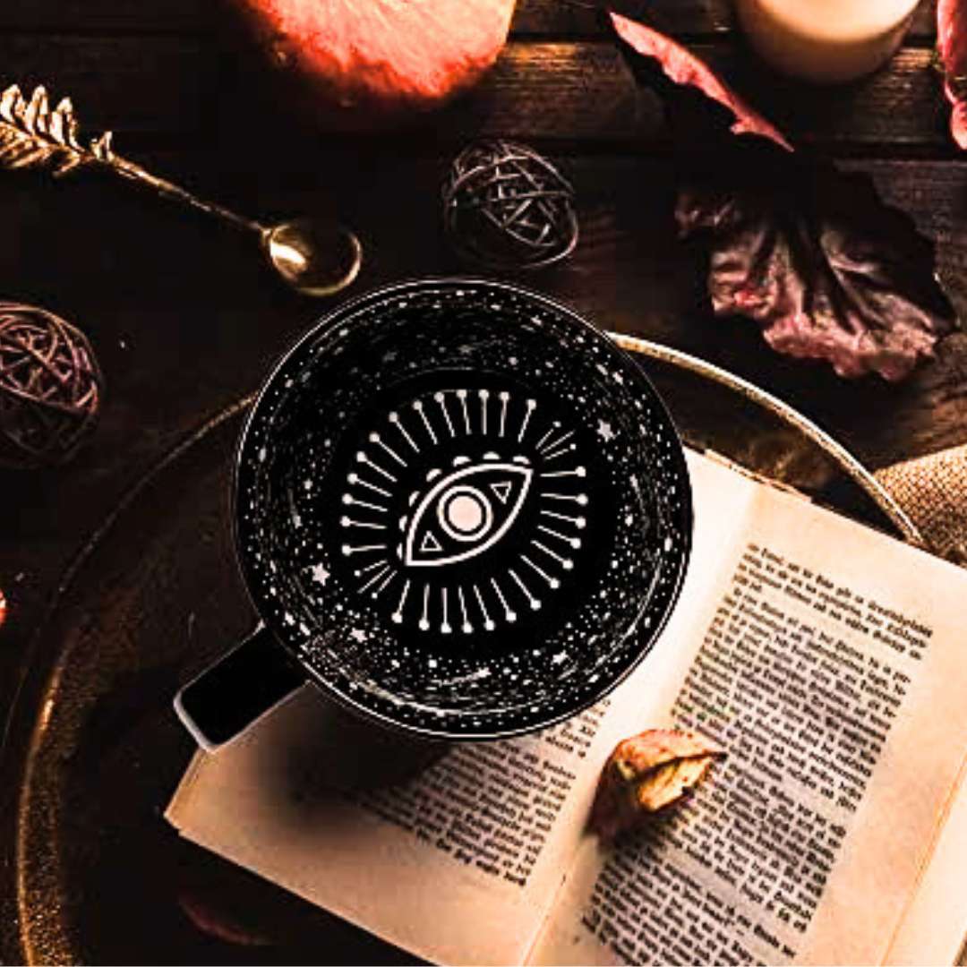Black mug with white mystic eye design. Witchy decor idea 