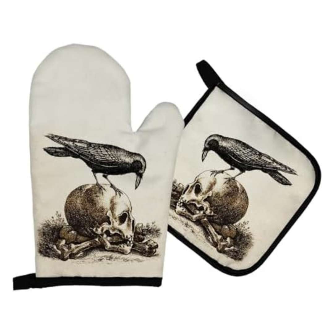 Set of witchy gothic style oven gloves with a realistic etching style raven and skull print