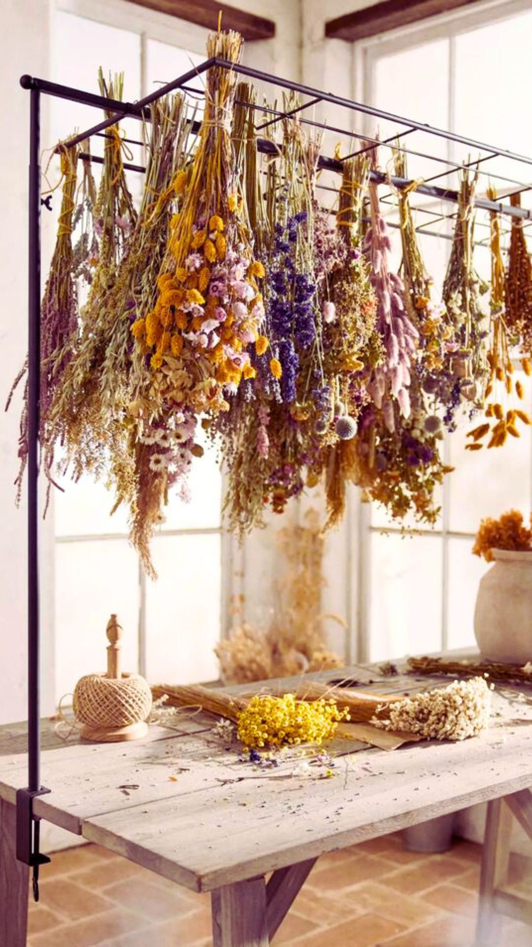 Boho style hanging herb frame in a kitchen witch inspired decor