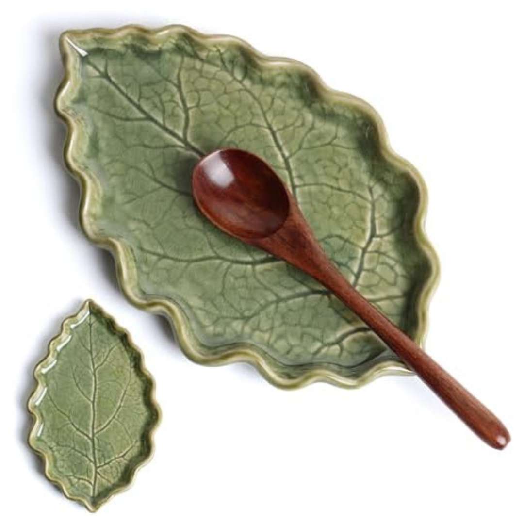 Green witch style kitchen accessory of a ceramic leaf shaped spoon stand