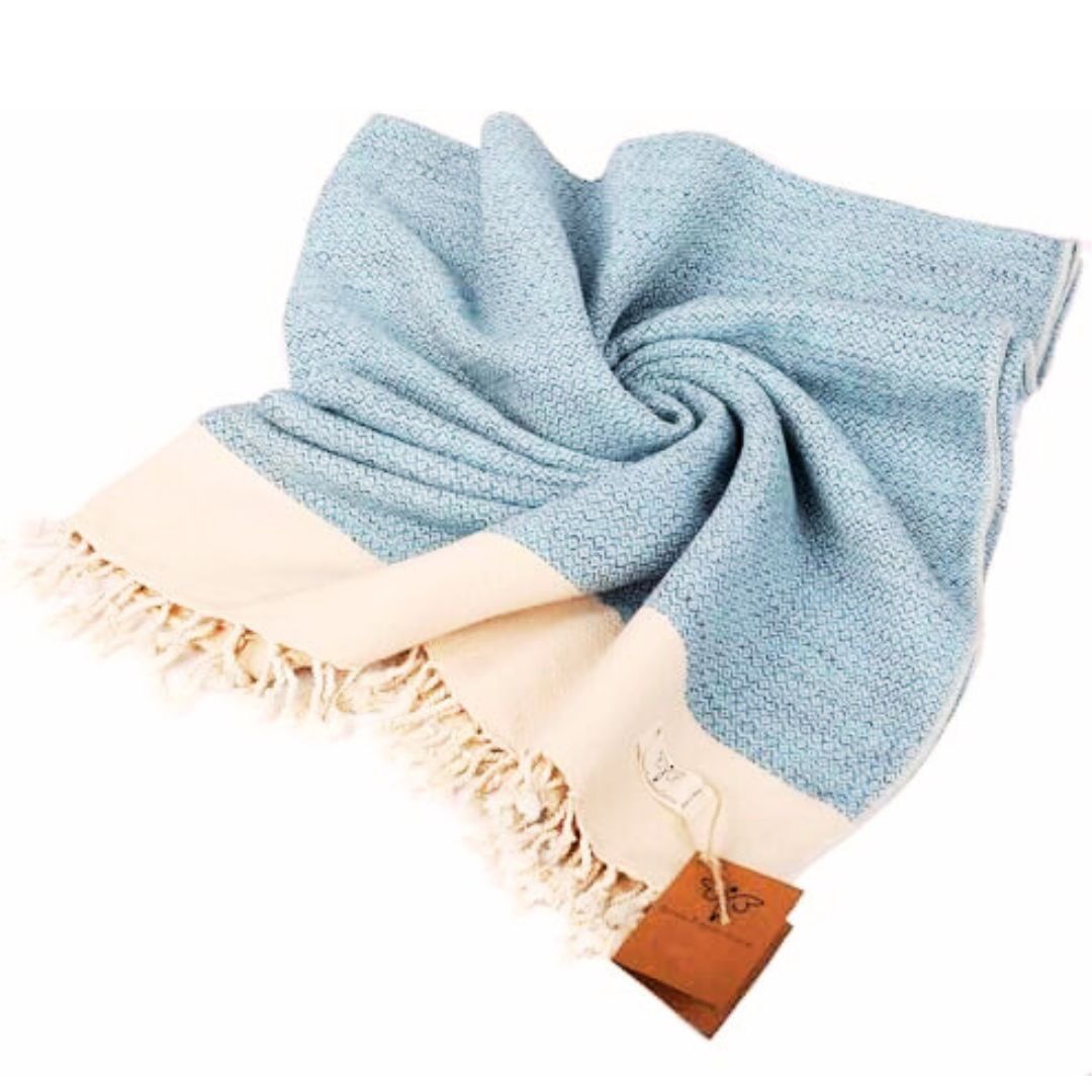 summer home decor accessory guide image of handwoven blue throw blanket