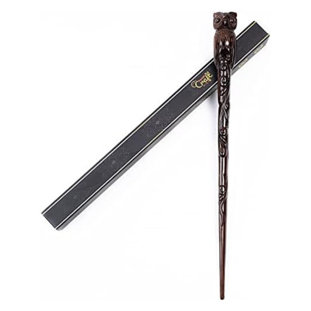 Hand carved wooden wand topped with a carved owl